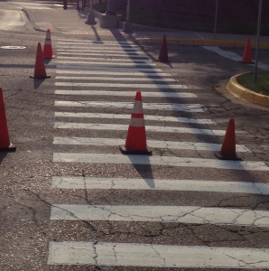 Before: Worn out cross walk paint with safety cones