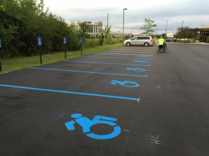 New blue handicap parking painting signage