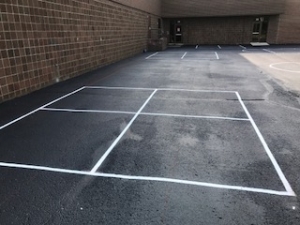 Side view of school four square court with new paint 