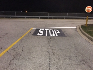 Newly painted STOP signage on road is easier to see