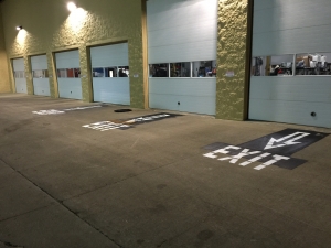 Warehouse exit signage pavement painting