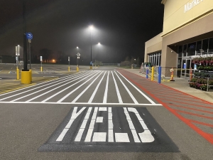 Yield sign in Walmart parking lot striping by Action Pavement Striping & Maintenance
